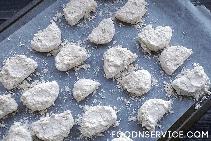 Dredge in milk and flour two times! Give it a double coating!