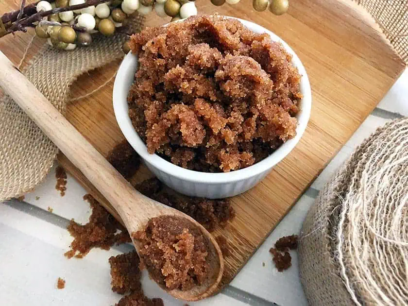 easy fall scented apple spice sugar scrub in a bowl and wooden spoon
