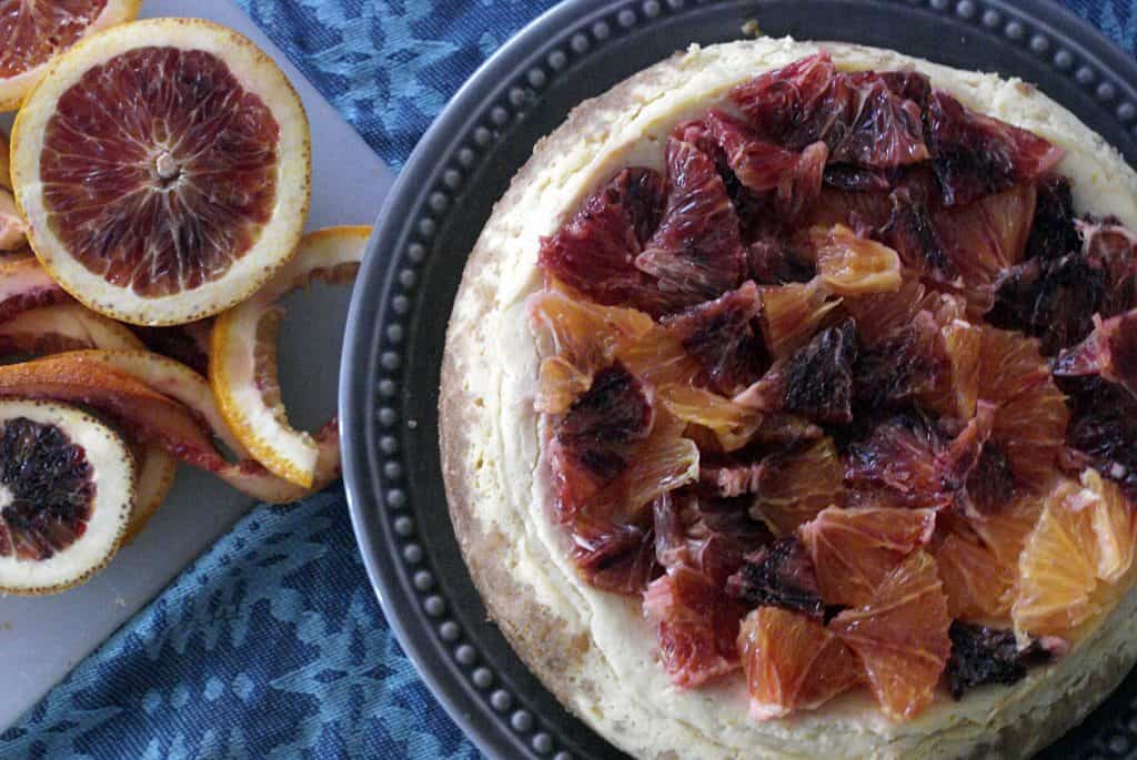 instant pot blood orange cheesecake on a grey plate