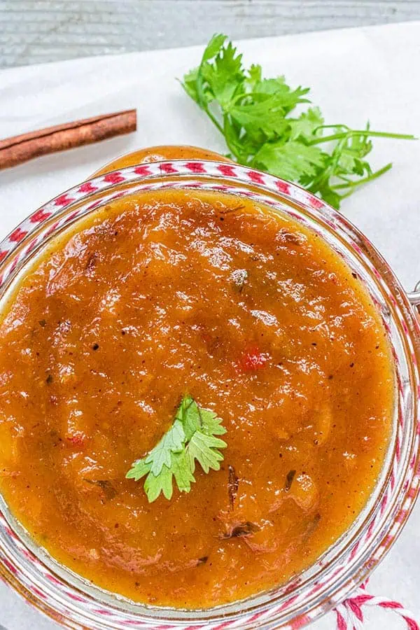 a close up shot of the Instant pot mango chutney in a storage jar