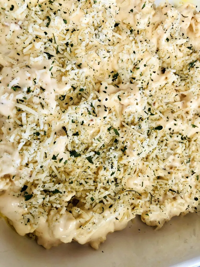 cauliflower mac and cheese ingredients in pan ready to be baked