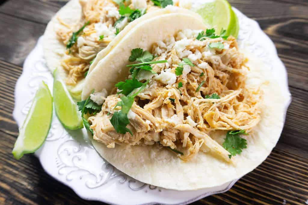 instant pot key lime tacos on a white plate in flour tortillas