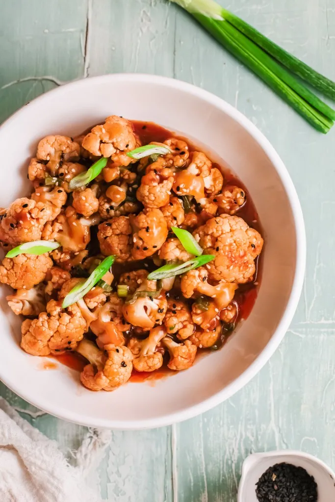 overhead image of korean cauliflower in a pink bowl