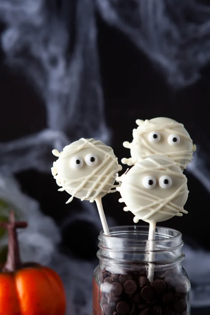 halloween oreo mummy pops in a glass jar