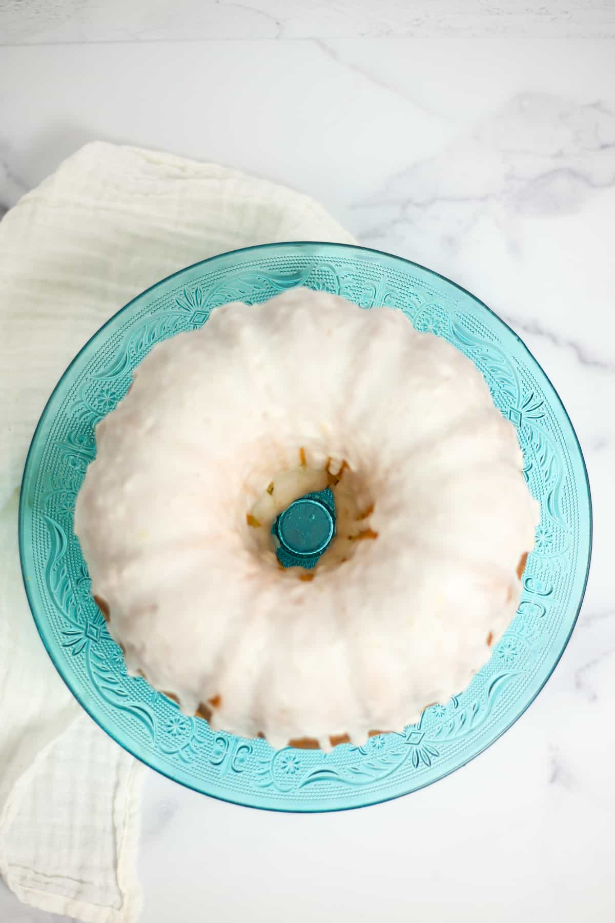 overhead shot of my lemon ginger bundt cake on a blue glass platter
