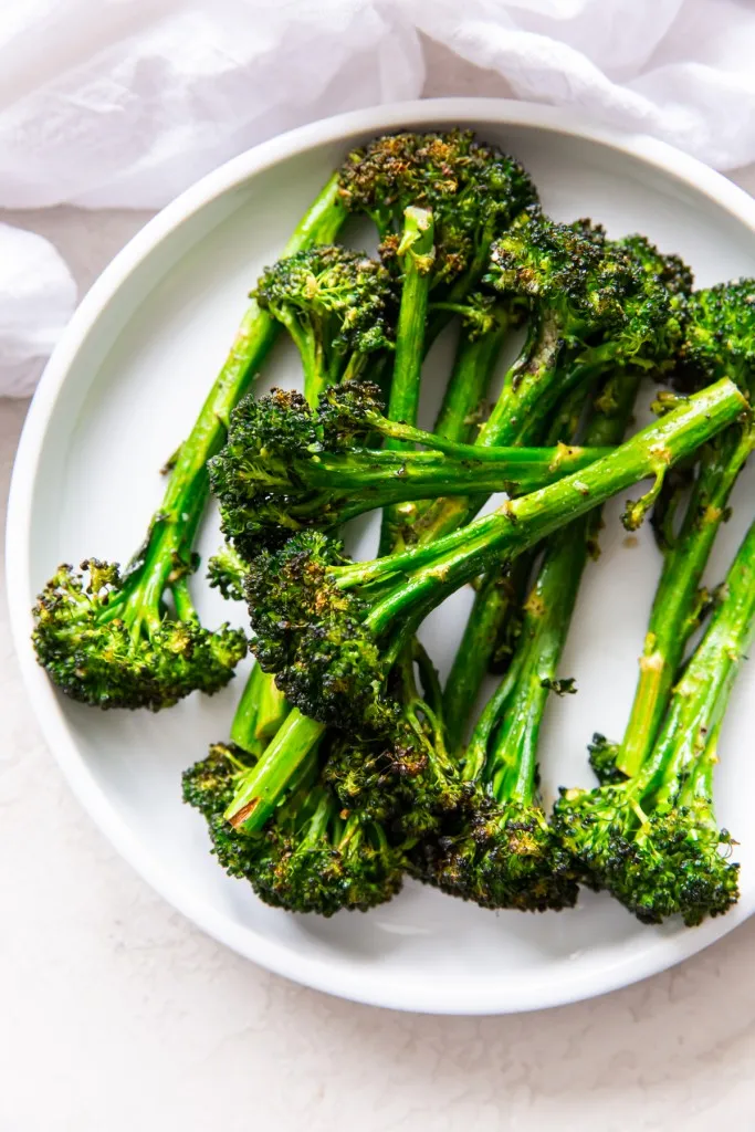 overhead view of air fryer broccolini