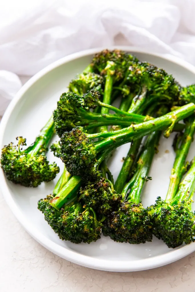 air fryer broccolini on a white plate