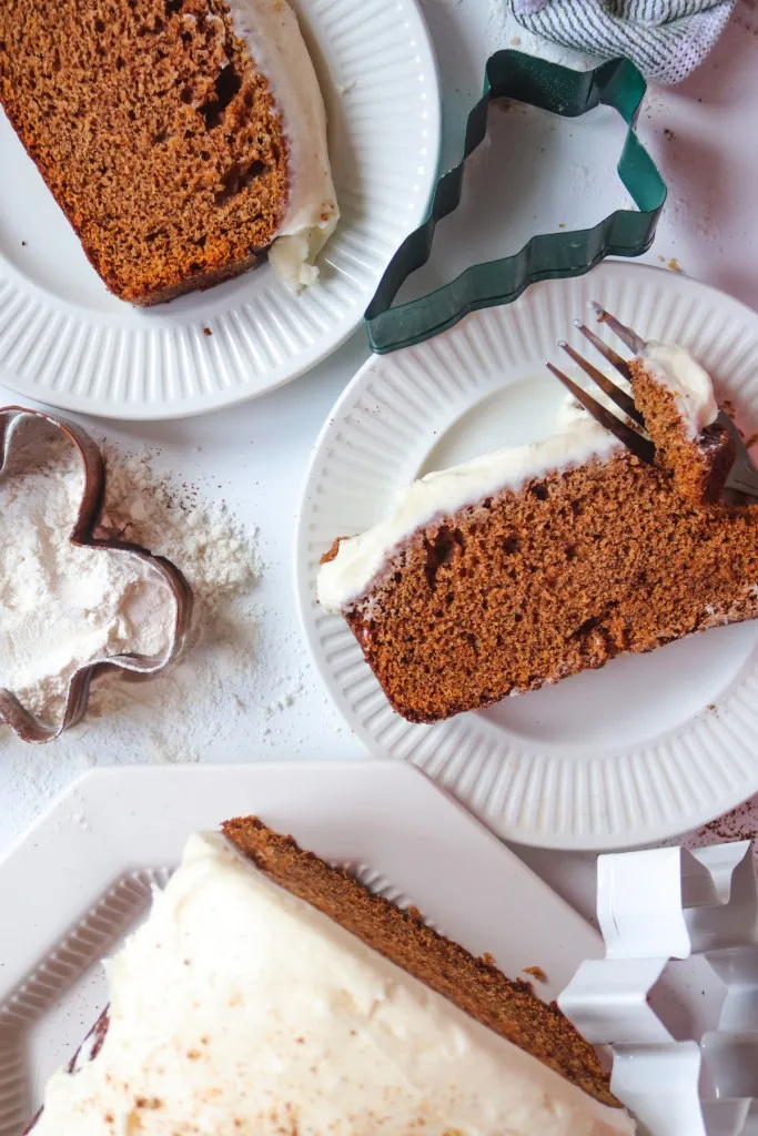 overhead view of sliced gingerbread loaf with cream cheese icing