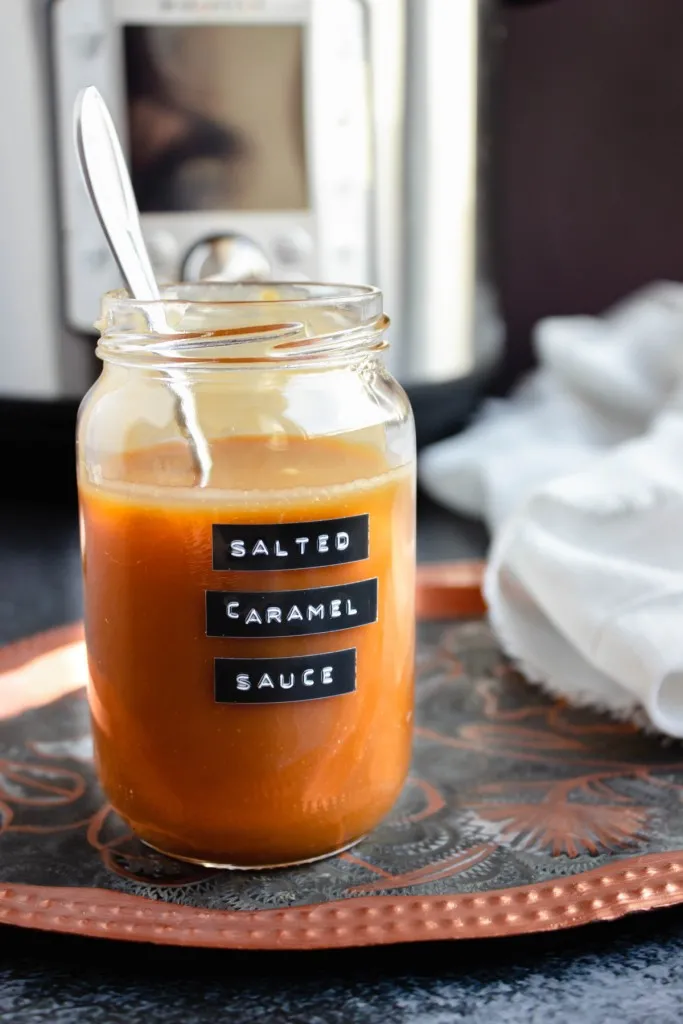instant pot salted caramel sauce with printed label on jar