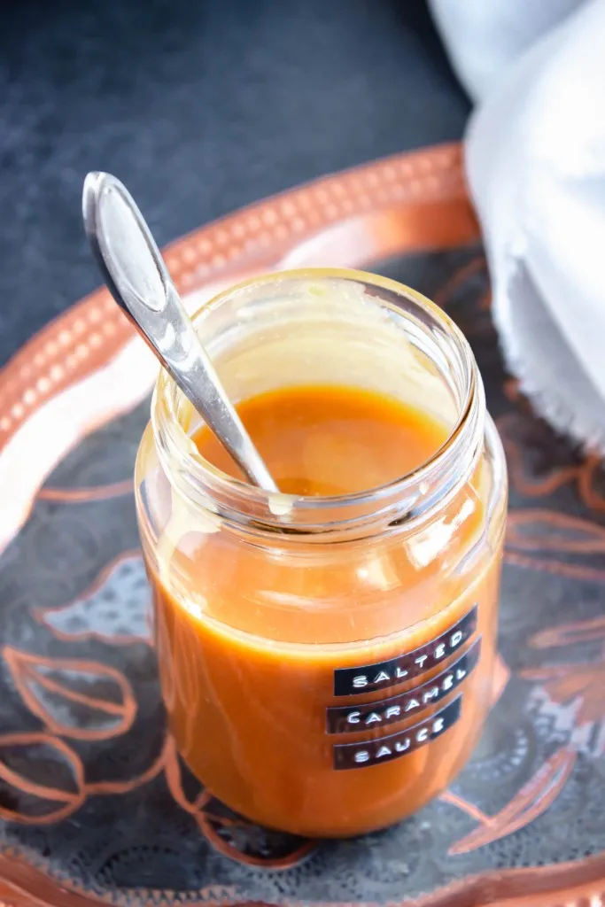 salted caramel sauce made in the instant pot on a black and orange plate