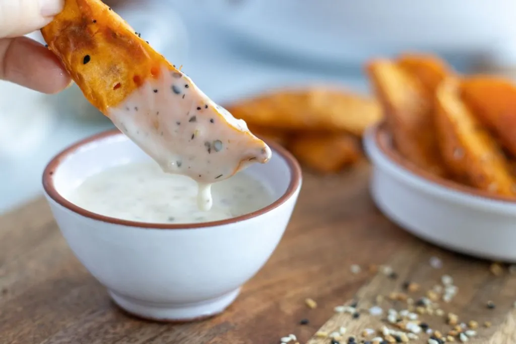 sweet potato wedge dipped in sauce