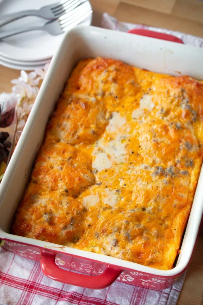 overhead shot of biscuits and gravy casserole on a red and white napkin