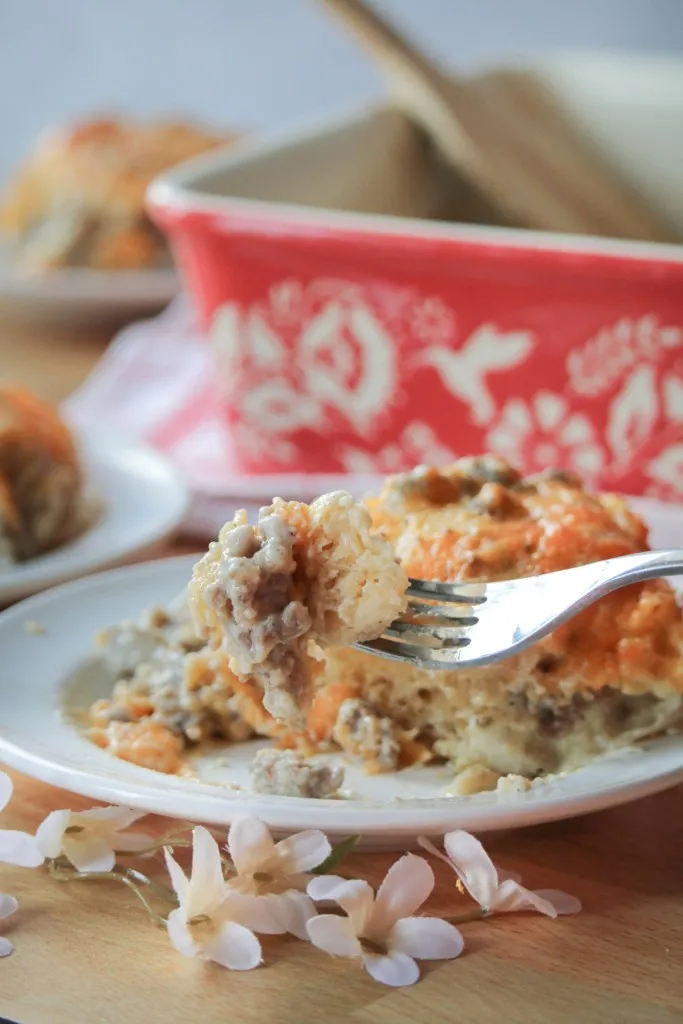 biscuits and gravy casserole in a red and white casserole dish