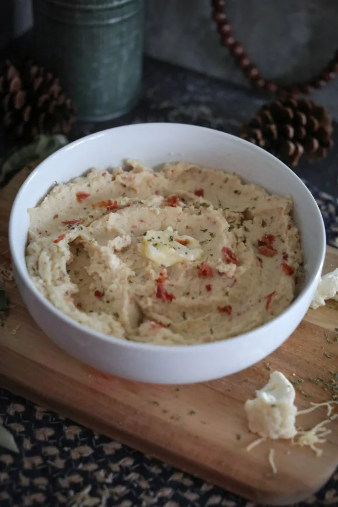 pat of butter on bowl of cauliflower mashed