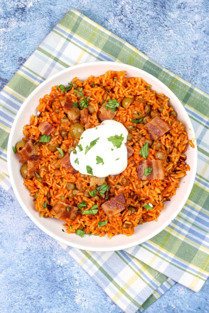 sour cream on top of arroz con gandules