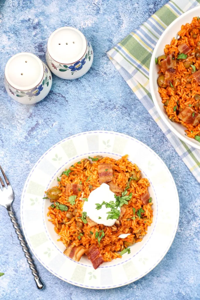 overhead shot of instant pot arroz con gandules with sour cream