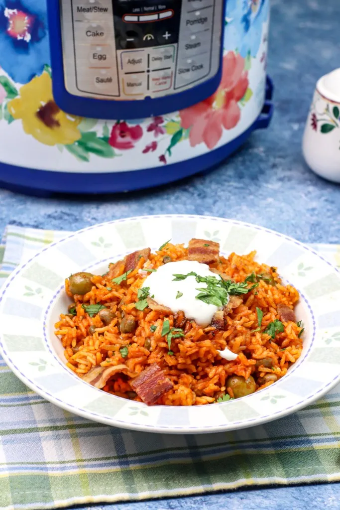 arroz con gandules in a bowl on top of a napkin