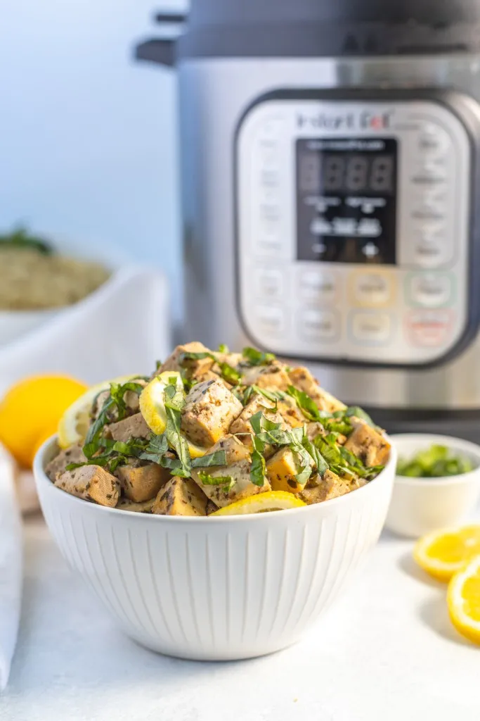 side view of lemon tofu made in the instant pot in a white bowl