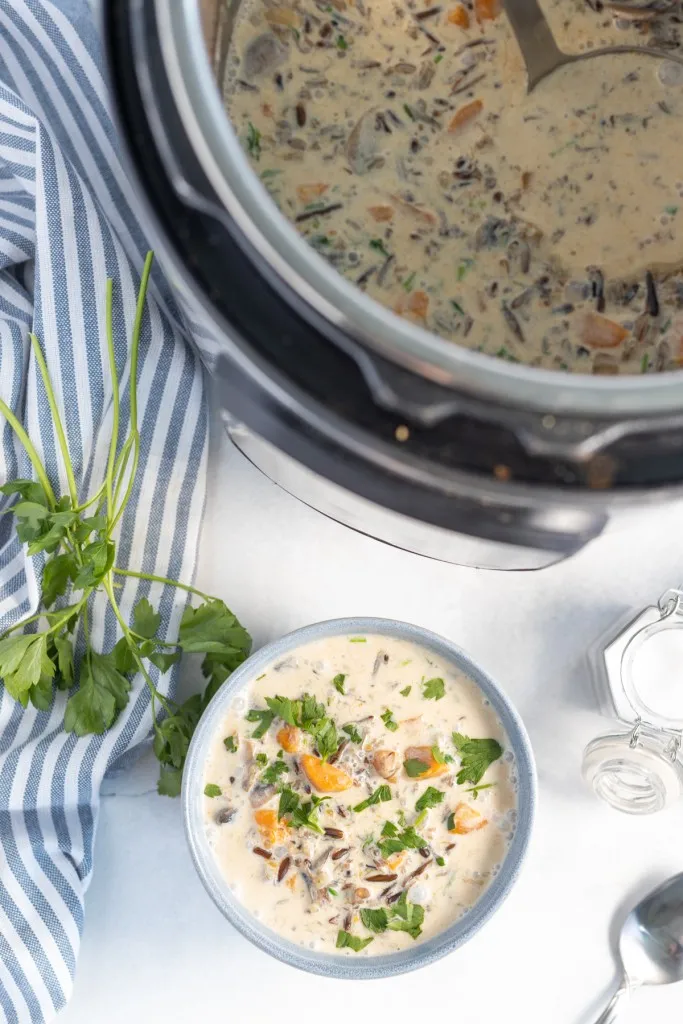 instant pot next blue bowl full of wild rice and mushroom soup