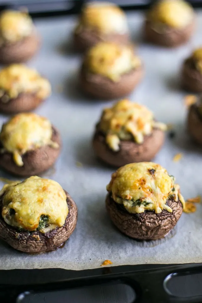 sheet tray of of cheesy stuffed mushrooms