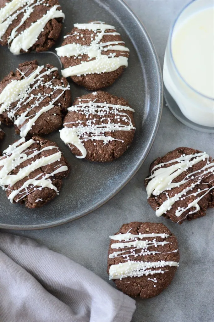 overhead shot of chocolate cookies with white chocolate drizzle
