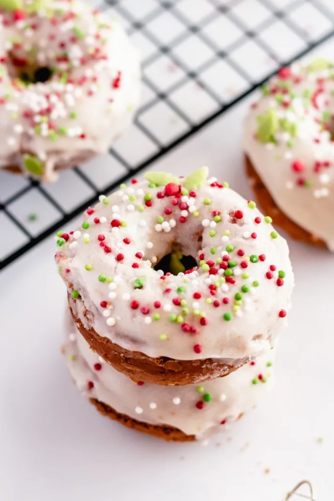 christmas sprinkles on top of glazed doughnuts