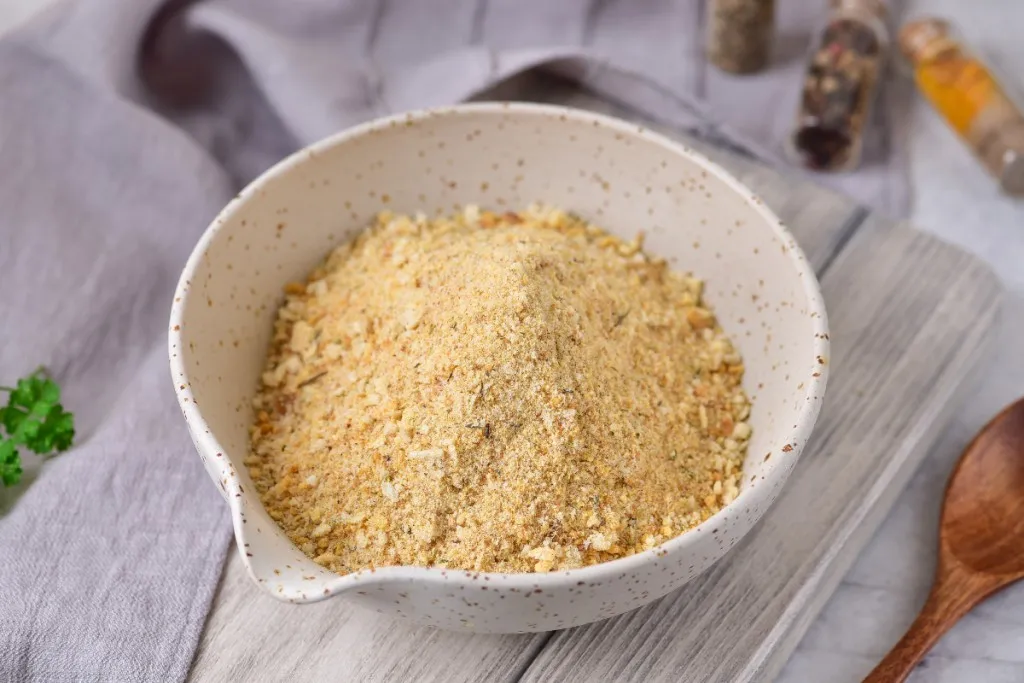 easy to make air fryer breadcumbs in a speckled bowl on a white wooden backgrounds