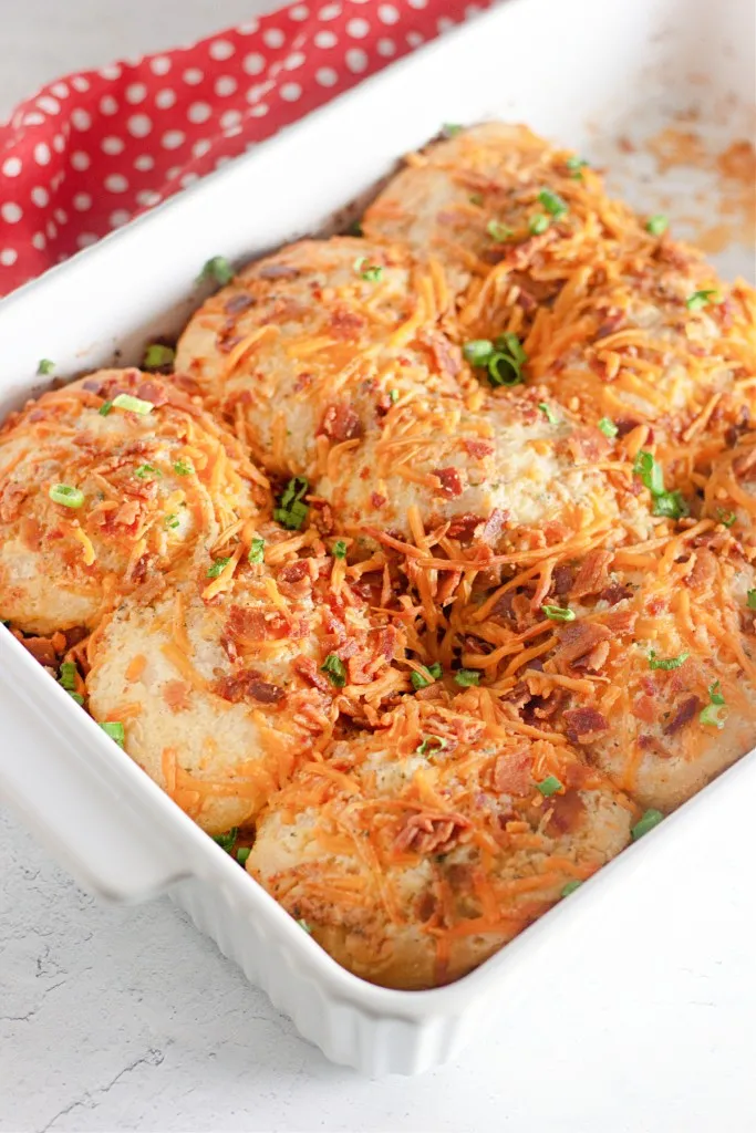 grated cheddar with diced scallions on a bacon ranch biscuits