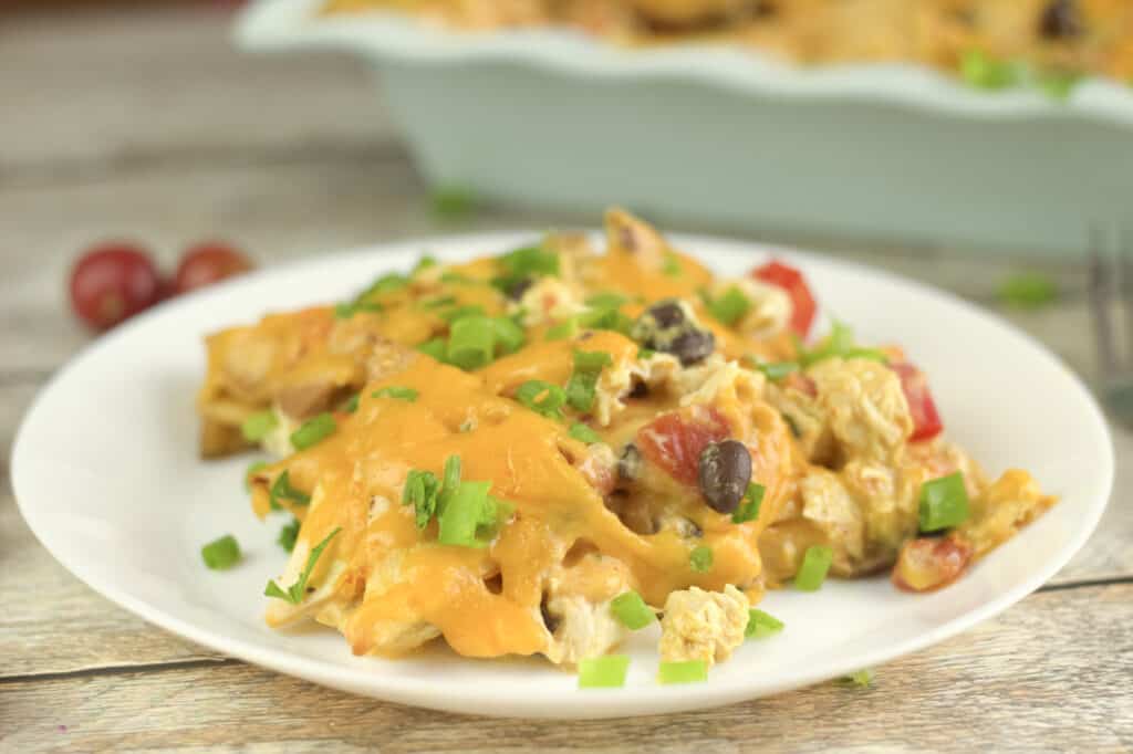 easy to make chicken taco casserole topped with cheese and green onions