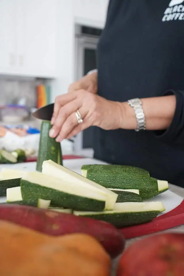how to cut the fresh zucchini for oven roasting with tomatoes and parmesan