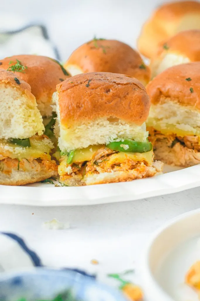 sideview shot of a plate full of buffalo chicken sliders for the big game