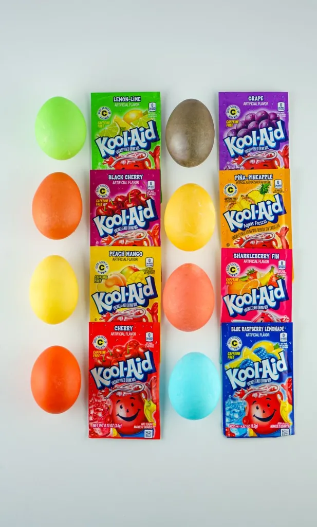 A list of all kool-aid colored dyed eggs next the the packet of kool-aid that colored the egg.