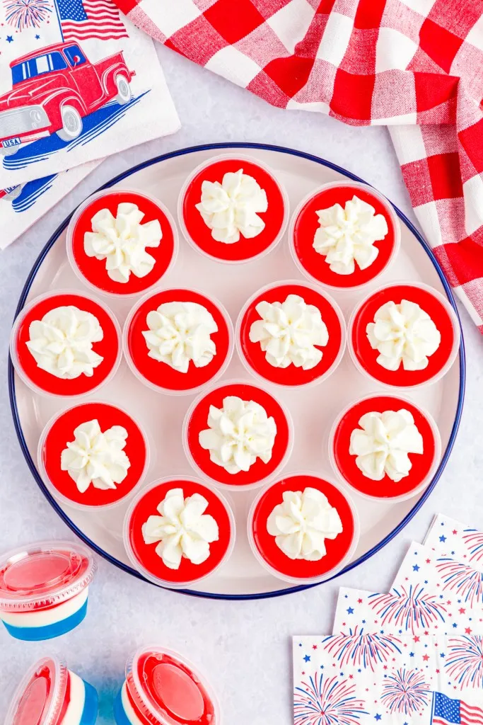 4th of july jello shots on a marble background and red and white napkin