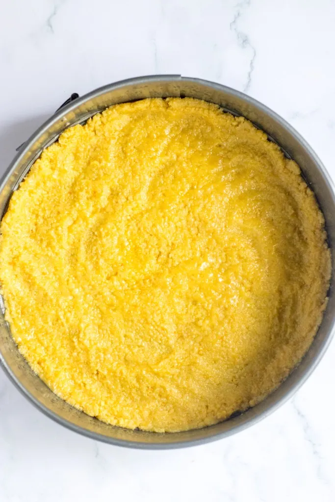 Shortbread crumb crust pressed into a springform pan.
