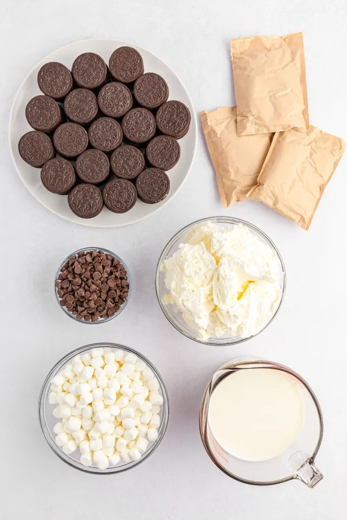 Oreo fluff salad ingredients on a white countertop.