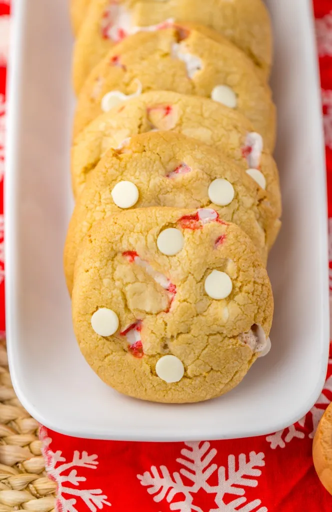 Close up of white chocolate peppermint cookies on a white serving plate.