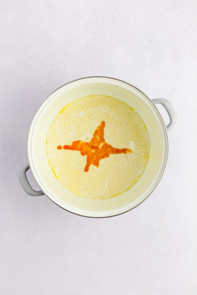 Large pot with melted butter, salt, and vanilla extract.