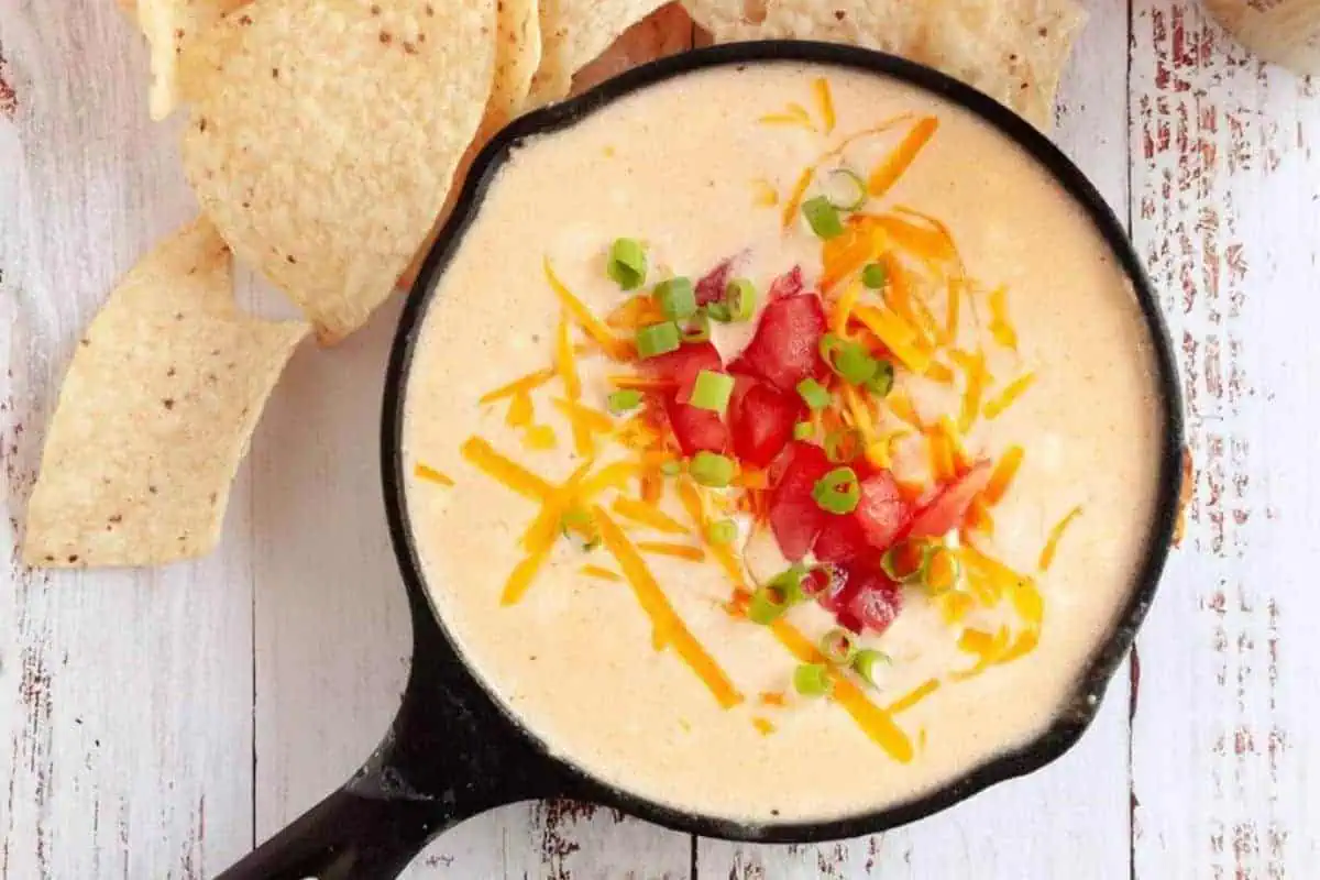 Beer cheese dip in a skillet.