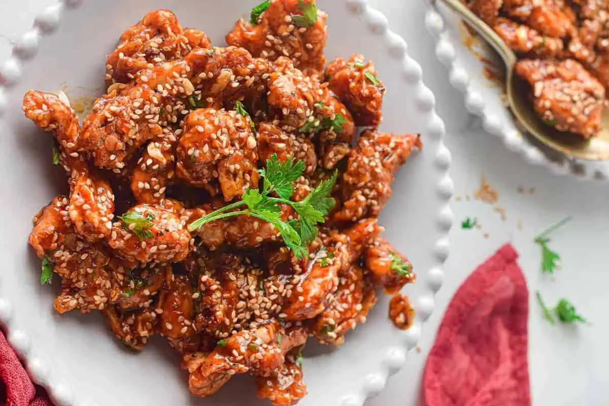 Sesame chicken on a plate.