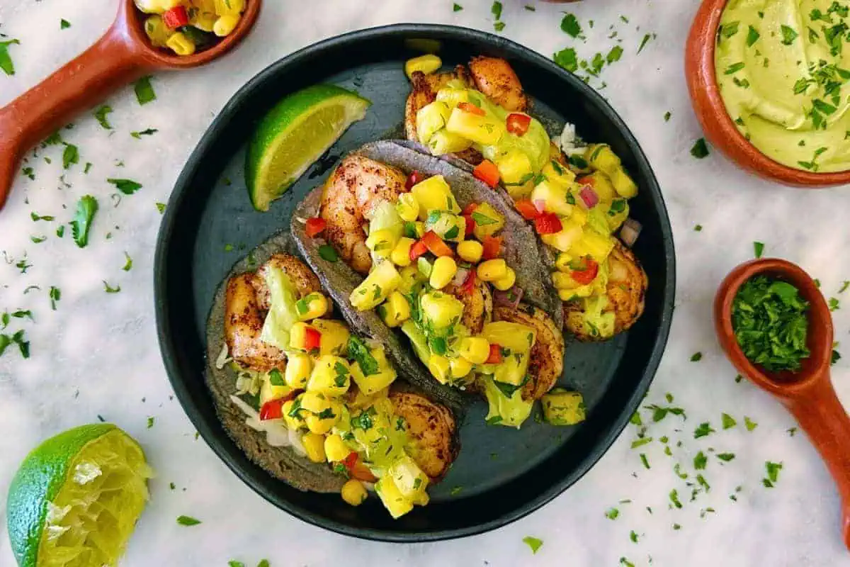 Shrimp tacos on a plate.