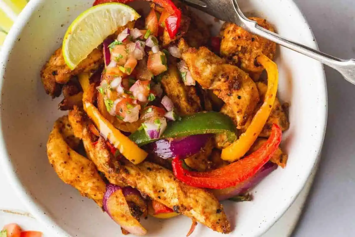 Chicken fajitas on a plate.