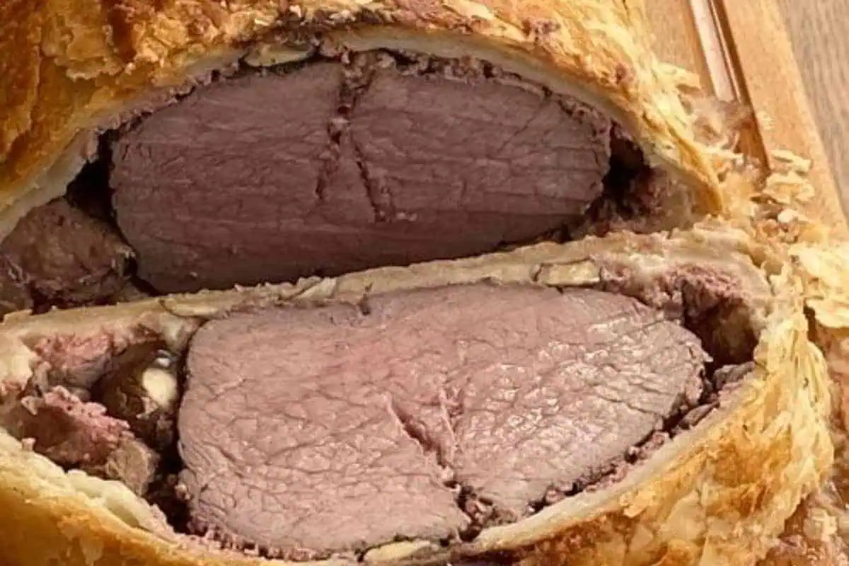 A sliced beef wellington.