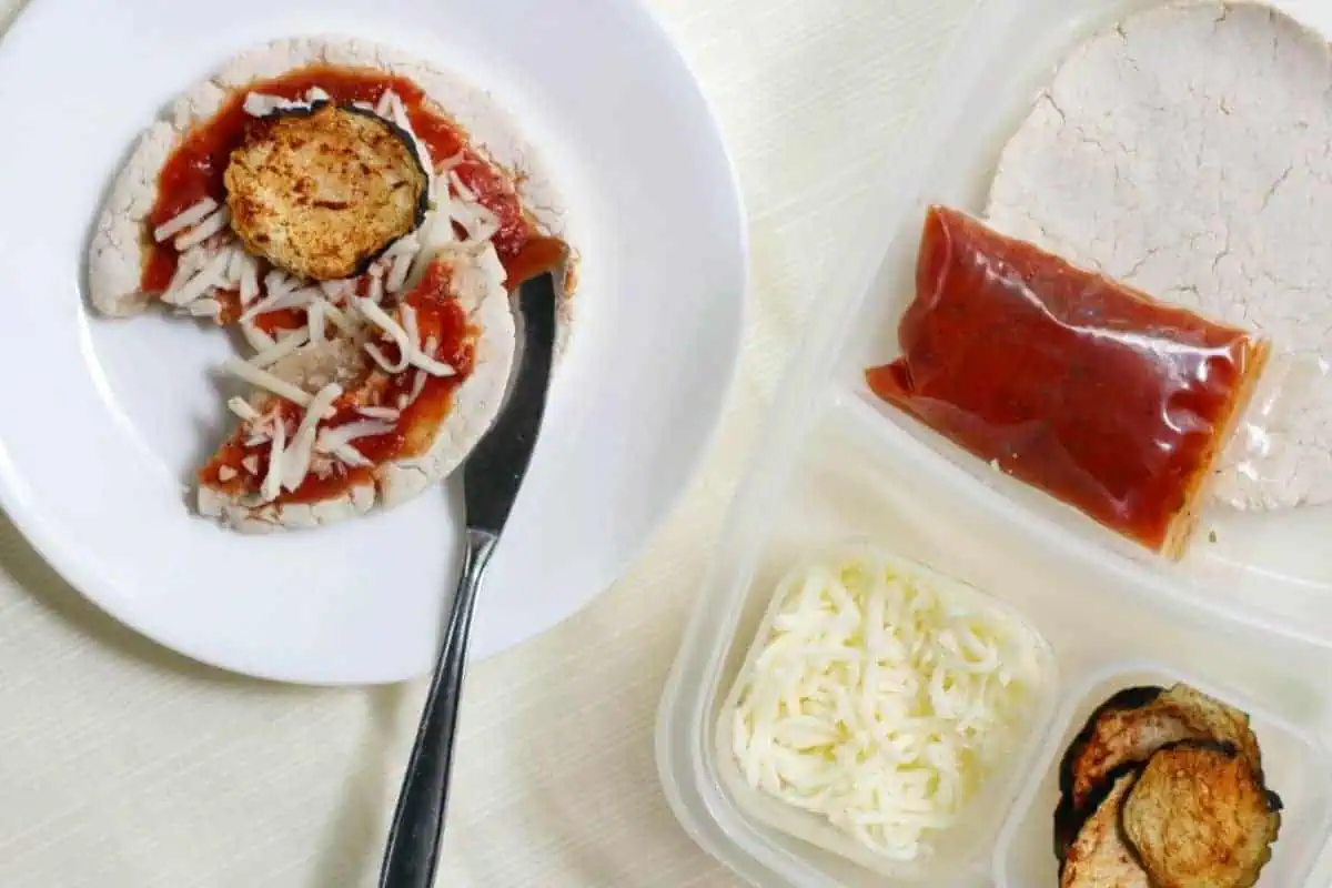 Vegan Cheese, sauce and eggplant on Gluten Free pizza crust