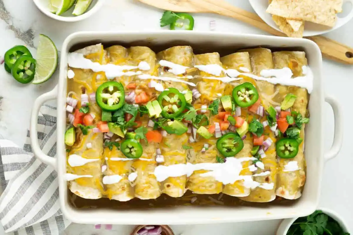 Pork enchiladas in a baking dish.