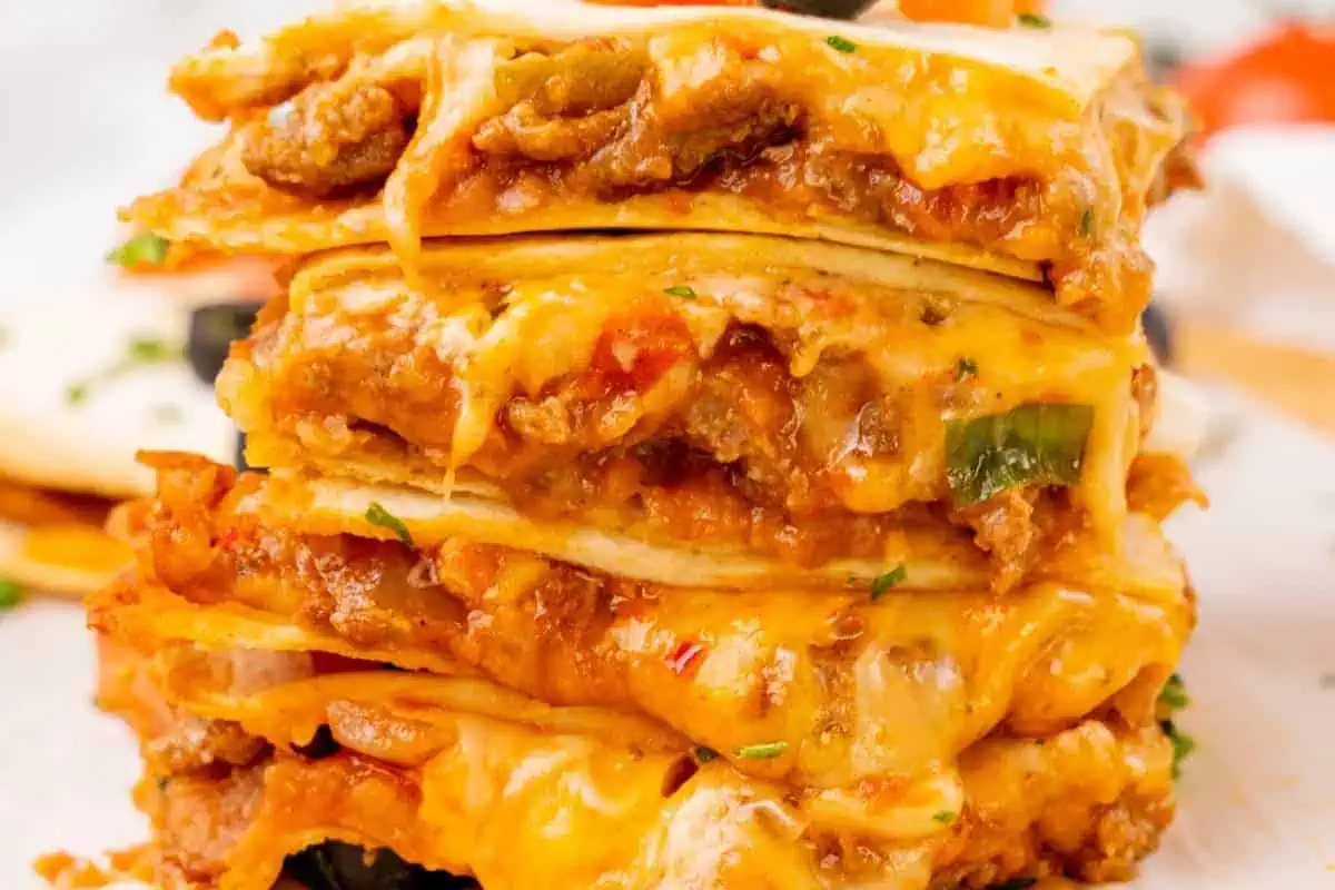 Stacked slices of Mexican pizza.
