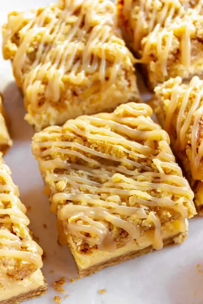 Close up of sliced apple cheesecake bars.