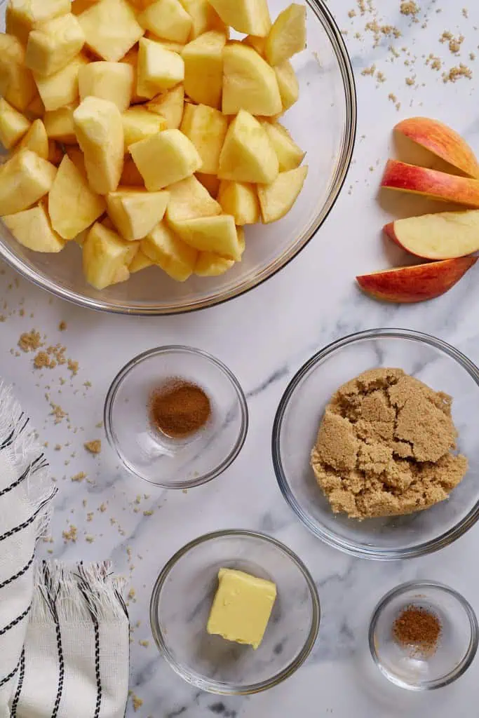 ingredients overview of caramel drizzled mini apple crisps with a buttery oat topping