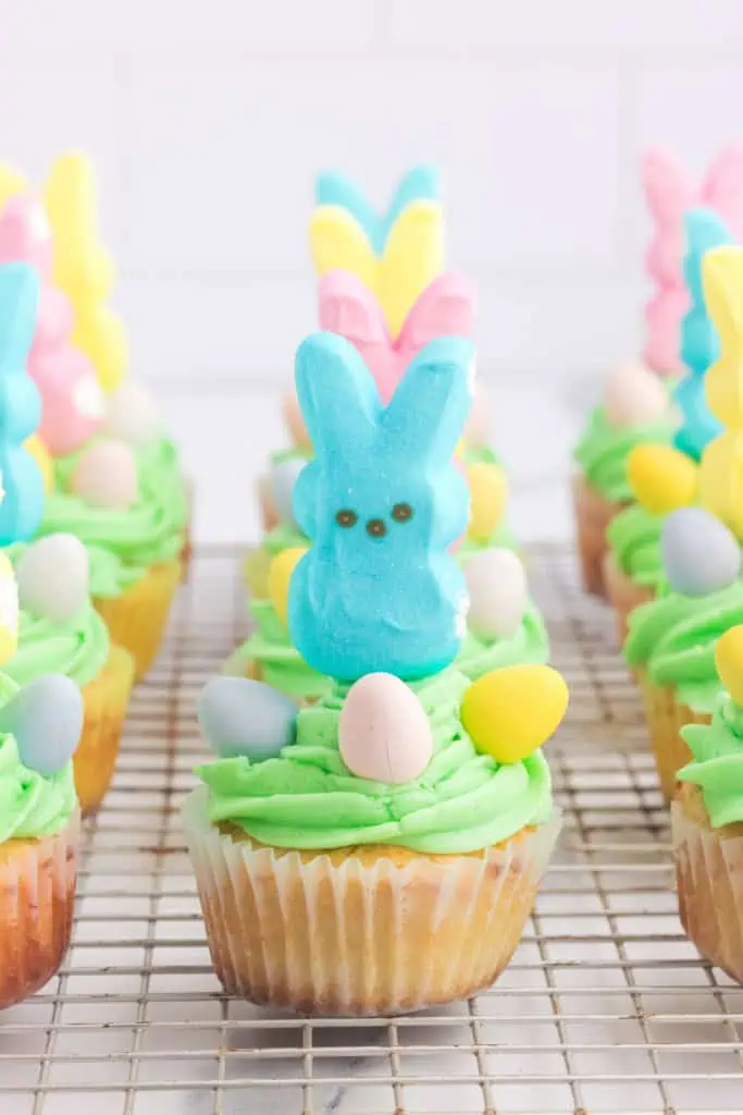 Assembled peeps cupcakes on a wire rack.