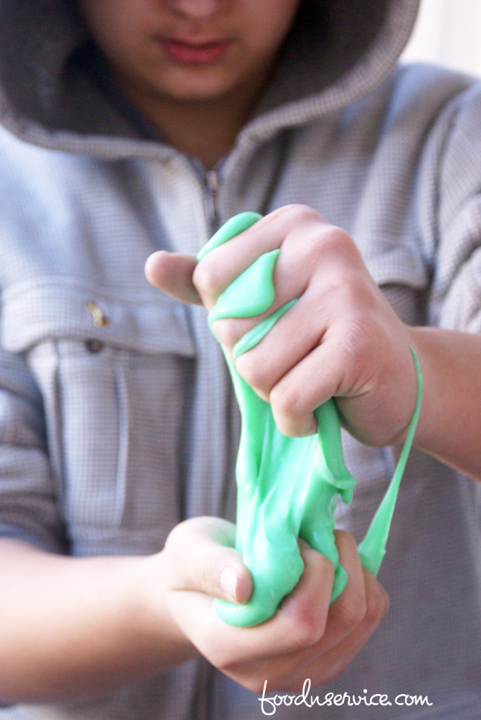 The easiest DIY green slime with glue to make! A fabulous sensory project to make with the kids. 