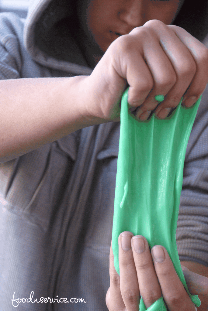 The easiest DIY green slime with glue to make! A fabulous sensory project to make with the kids. 